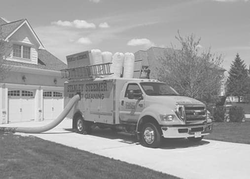 Stanley Steemer truck-mounted air duct cleaning van