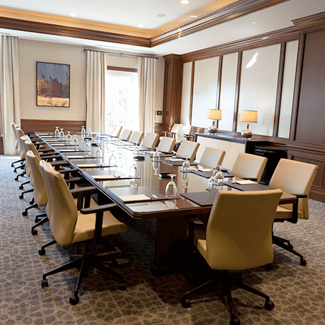 Conference room with large table and chairs in event center Conference room with large table and chairs in event center