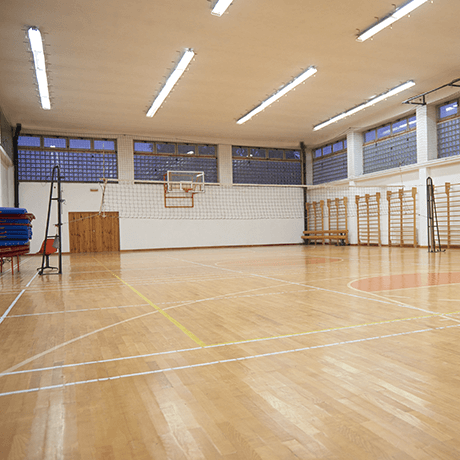 Court with hardwood floors in fitness facility Court with hardwood floors in fitness facility