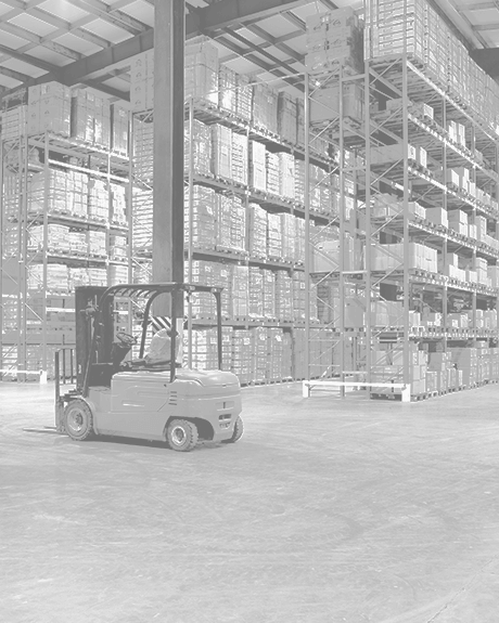Forklift surrounded by high shelves filled with boxes in warehouse Forklift surrounded by high shelves filled with boxes in warehouse