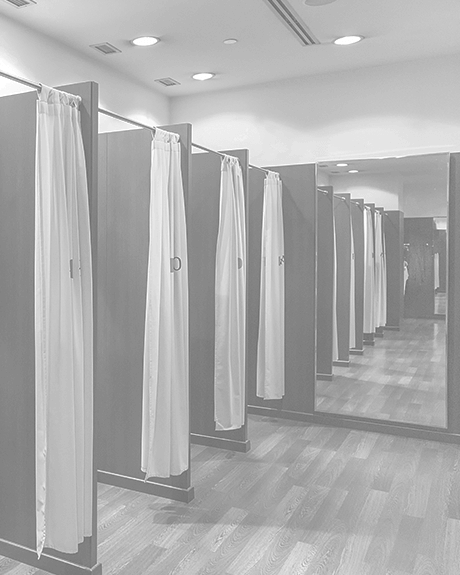 Changing rooms with hardwood floors inside of retail store Changing rooms with hardwood floors inside of retail store