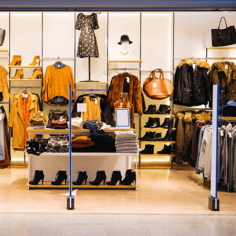 In front of clothing store with tile and hardwood floors In front of clothing store with tile and hardwood floors