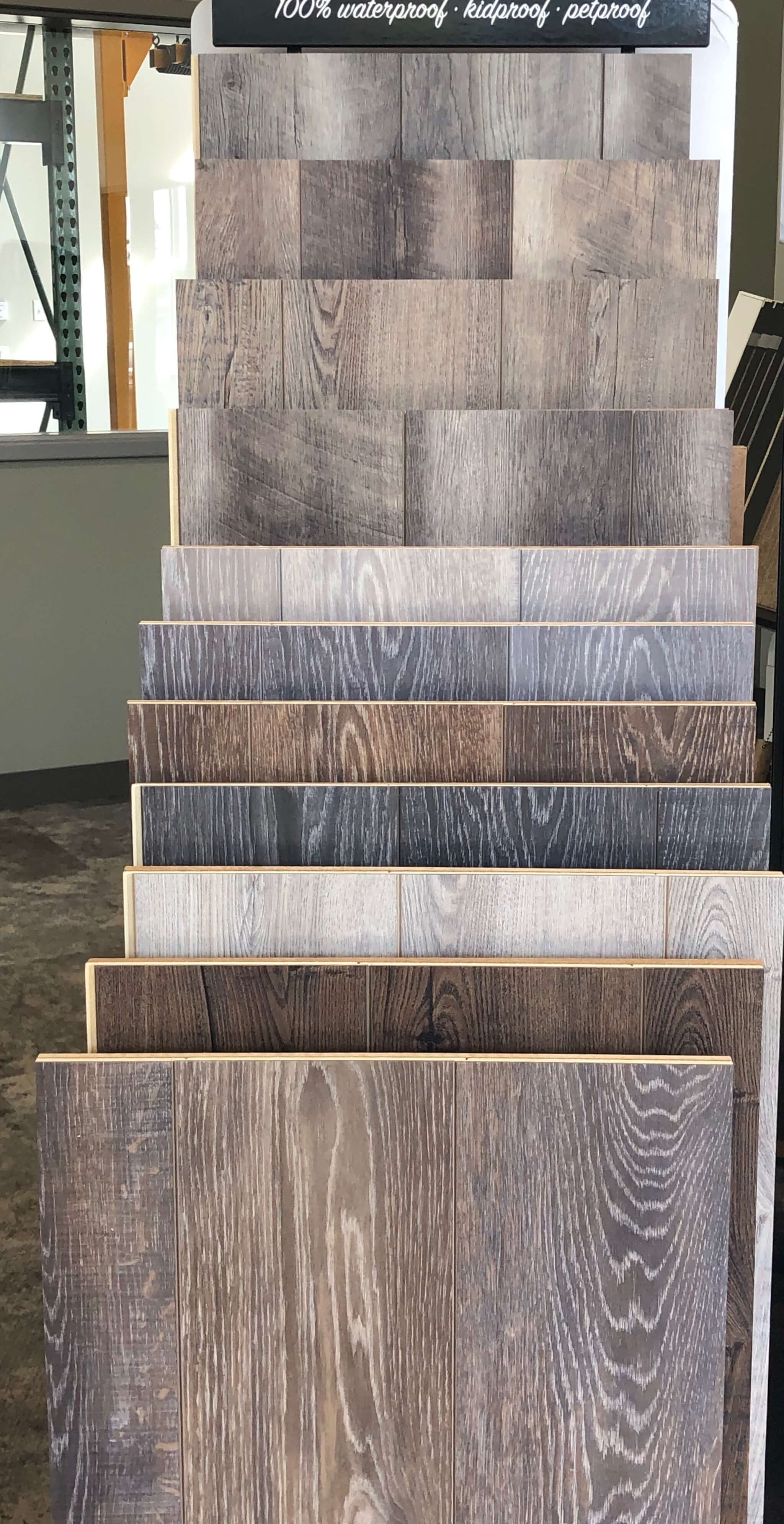 Detailed image of luxury vinyl tile samples at Stanley Steemer floor showroom in Kalamazoo