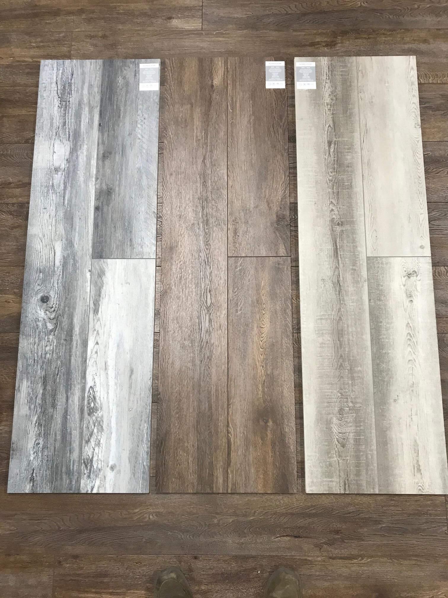 Side by side of three LVT floor samples at a Stanley Steemer showroom in Kalamazoo