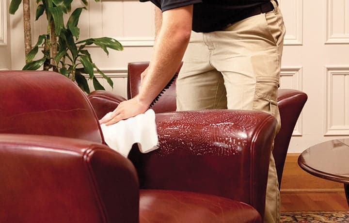 Technician buffing leather furniture Technician buffing leather furniture