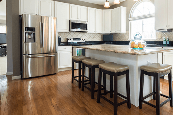 Hardwood floored kitchen with a large island and open concept