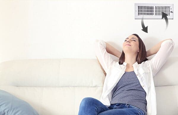 Woman breathing clean indoor air Woman breathing clean indoor air