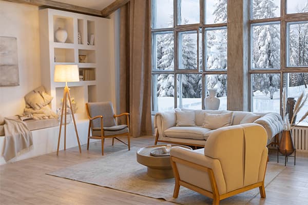 Winter Home Photo living room during winter with snow outside visible through windows