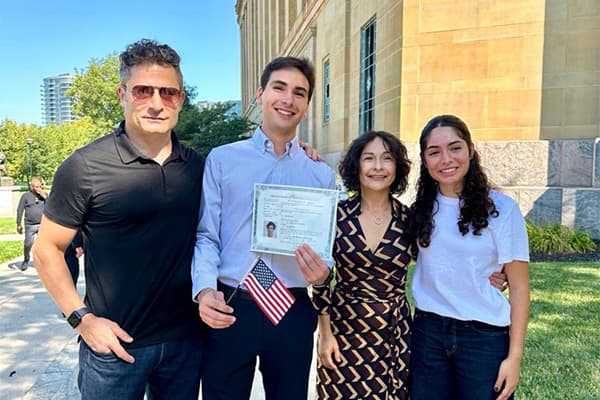 Joel & Family joel and dad and mom and sister outside state building