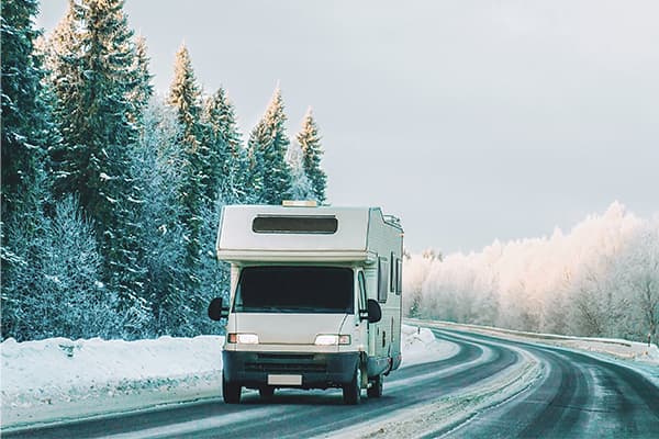 RV driving on snowy road RV driving on snowy road
