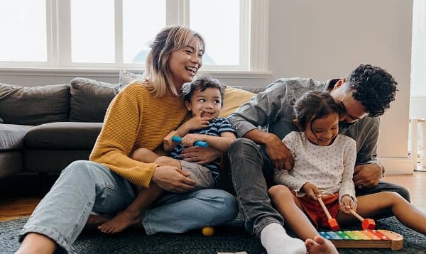 family laughing in living room