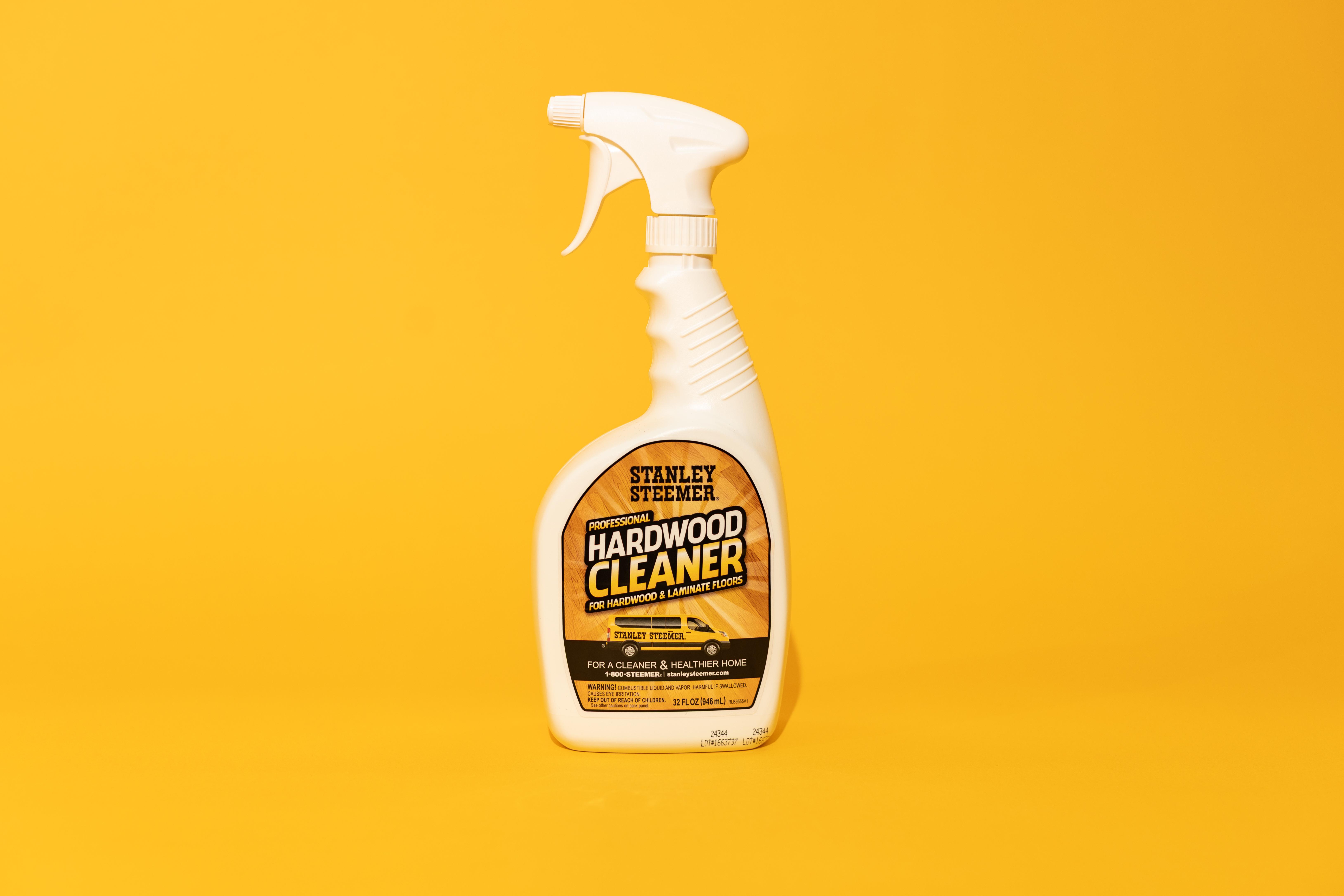 Stanley Steemer Hardwood Floor Cleaner stanley steemer hardwood floor cleaner bottle against orange background