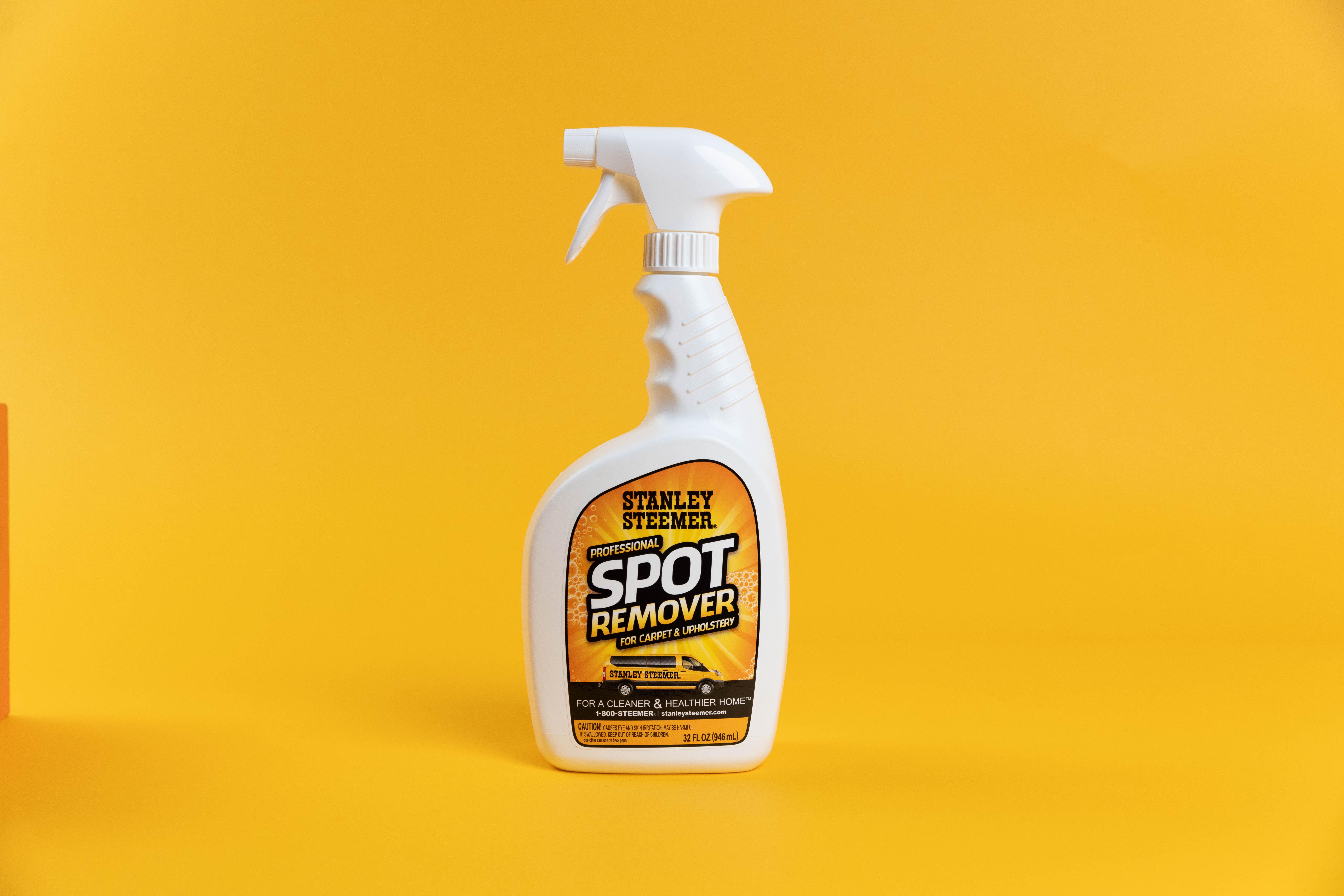 Stanley Steemer Spot Remover bottle of stanley steemer spot remover against orange background