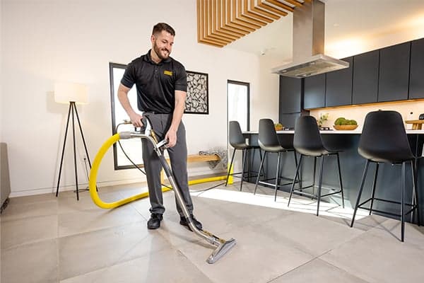 Tile and Grout Cleaning Wand tech using stanley steemer tile and grout wand in customer kitchen