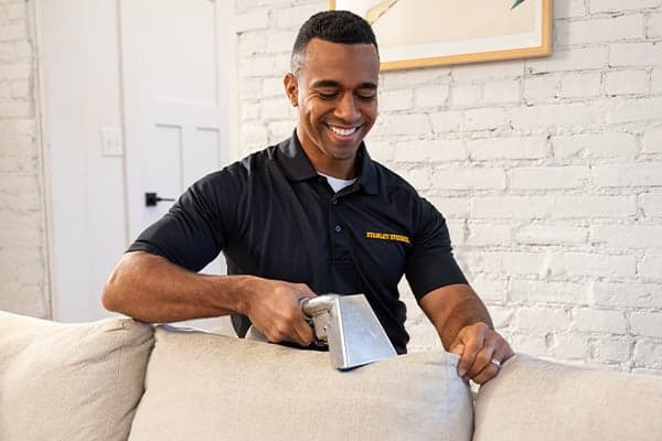 Technician Cleaning Upholstery tech cleaning white upholstery